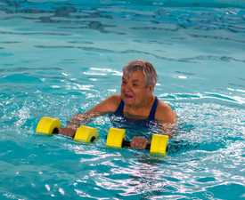 person exercising in warm water pool