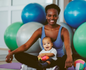 mother and child with yoga balls